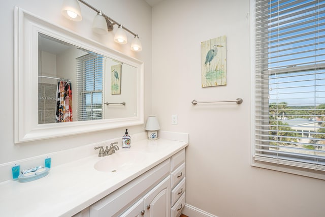 bathroom with a shower with curtain and vanity