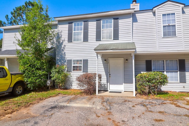 multi unit property featuring a chimney