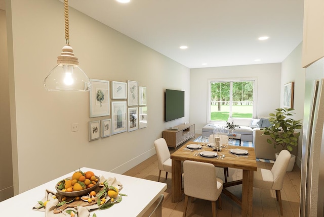 dining space with light hardwood / wood-style floors