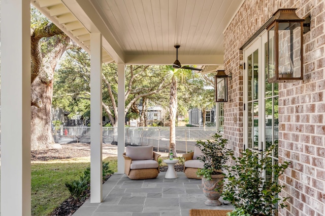 view of patio featuring ceiling fan