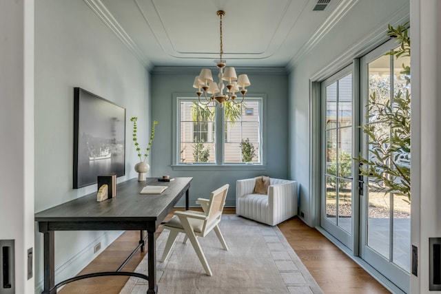 interior space with crown molding, a healthy amount of sunlight, a chandelier, and light hardwood / wood-style floors