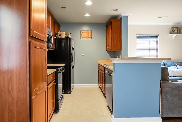 kitchen with stainless steel appliances, light countertops, a peninsula, visible vents, and recessed lighting