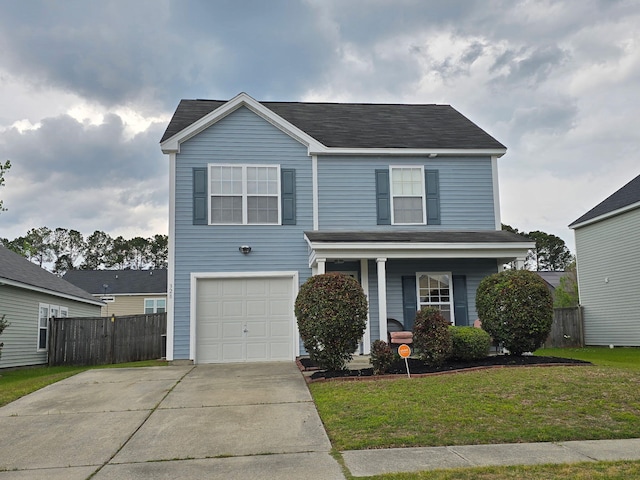 traditional-style house featuring a front yard, covered porch, a garage, fence, and driveway