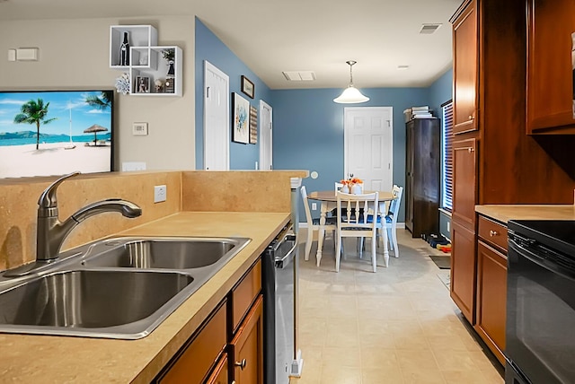 kitchen with black range with electric cooktop, a sink, visible vents, and light countertops