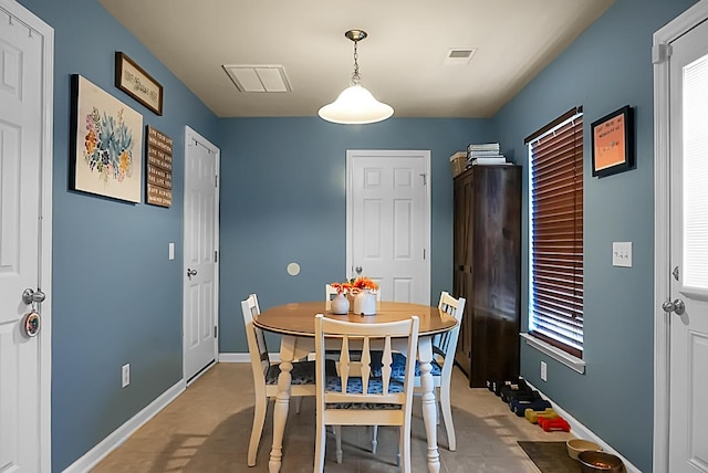 dining area with baseboards and visible vents