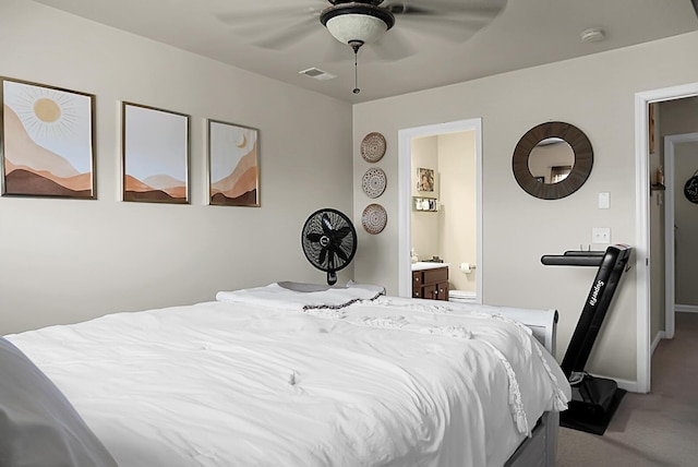 carpeted bedroom with visible vents, baseboards, ceiling fan, and connected bathroom