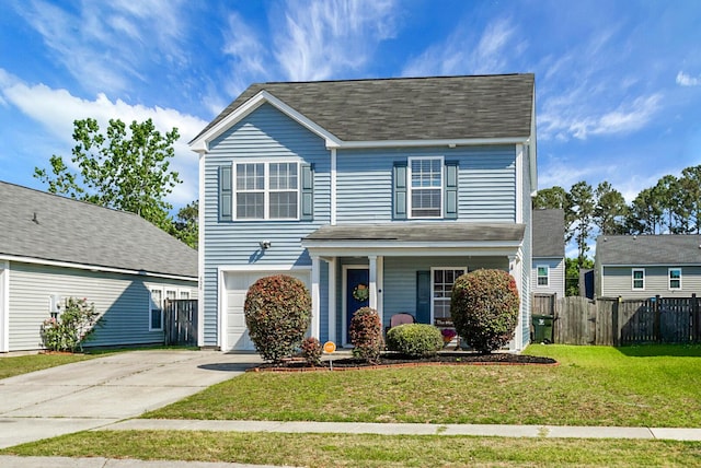 traditional-style home with fence, concrete driveway, an attached garage, covered porch, and a front yard