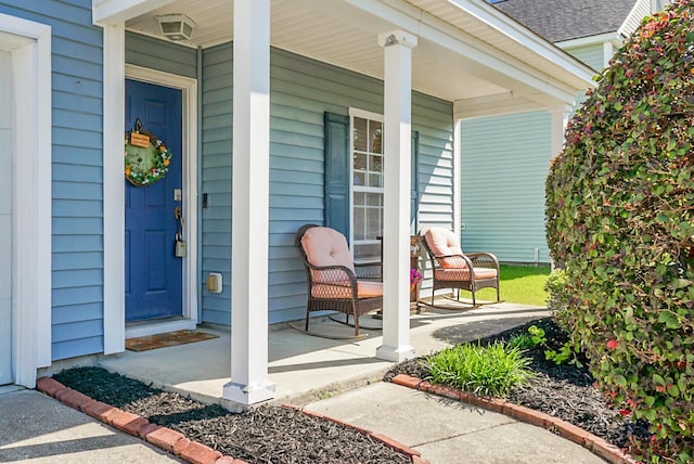 entrance to property featuring covered porch