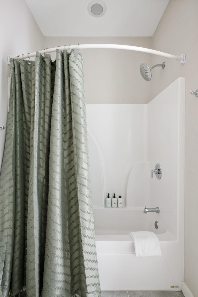 bathroom featuring shower / bath combo with shower curtain