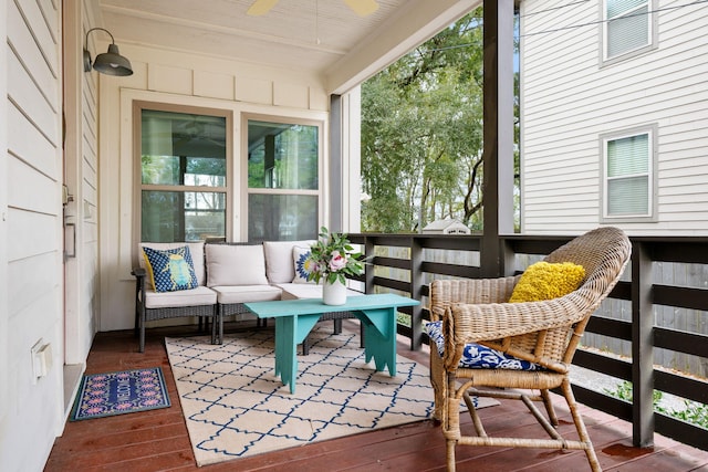 exterior space featuring an outdoor living space and a ceiling fan