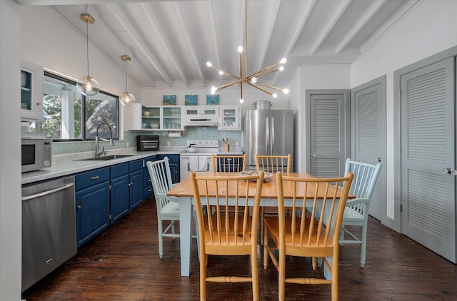 2619 Buccaneer Rd, Isle Of Palms, SC 29451 - dining room featuring dark wood-type flooring and a chandelier