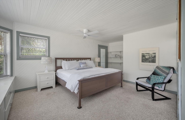 2619 Buccaneer Rd, Isle Of Palms, SC 29451 - bedroom with light carpet, baseboards, a ceiling fan, and wood ceiling