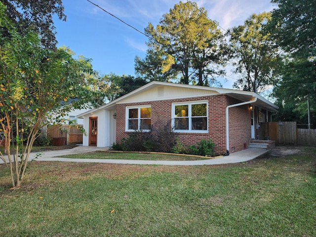 ranch-style home with a front yard