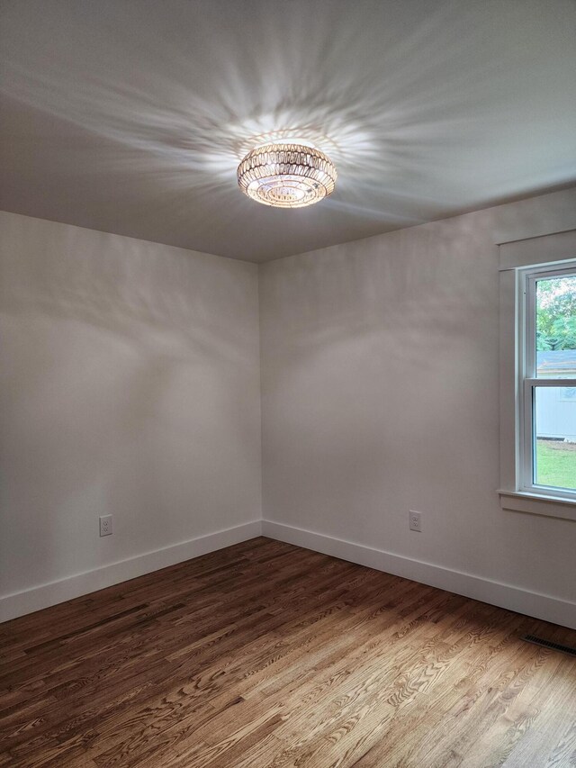 spare room featuring hardwood / wood-style flooring