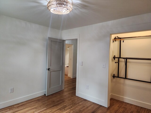 unfurnished bedroom with wood-type flooring