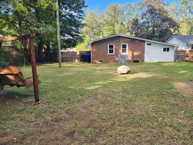 view of yard featuring central air condition unit