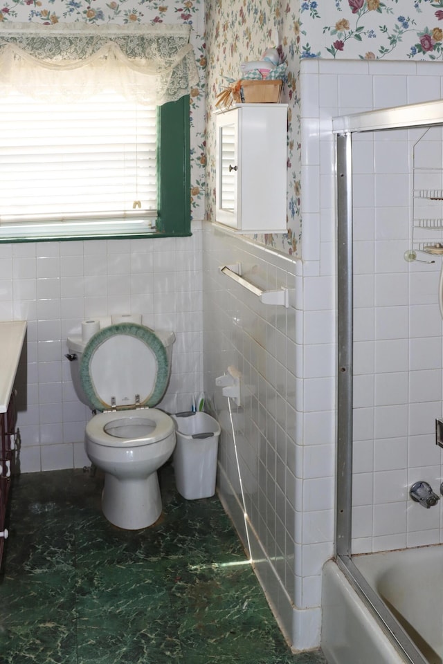 5286 Cameron Rd, Cameron, SC 29030 - full bathroom with combined bath / shower with glass door, wallpapered walls, a wainscoted wall, toilet, and tile walls