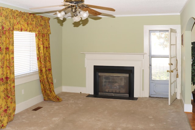 5286 Cameron Rd, Cameron, SC 29030 - unfurnished living room featuring ornamental molding, carpet floors, a fireplace with flush hearth, visible vents, and ceiling fan