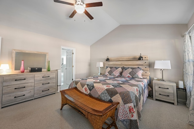 carpeted bedroom with ceiling fan, lofted ceiling, and connected bathroom