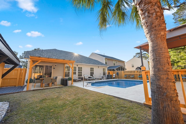 view of swimming pool with a yard and a patio area