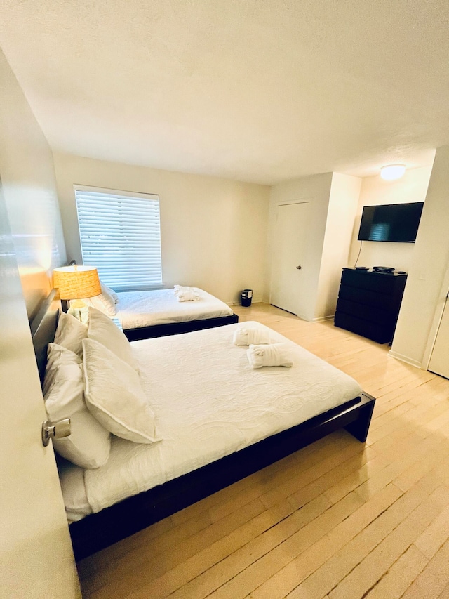 bedroom with light wood-type flooring