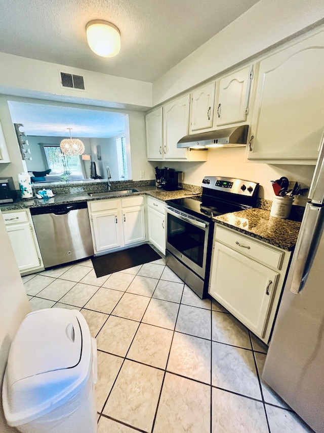 kitchen featuring white cabinetry and stainless steel appliances