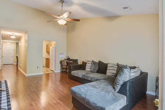 7896 Montview Rd, North Charleston, SC 29418 - living area with a ceiling fan, light wood-style floors, baseboards, and a towering ceiling