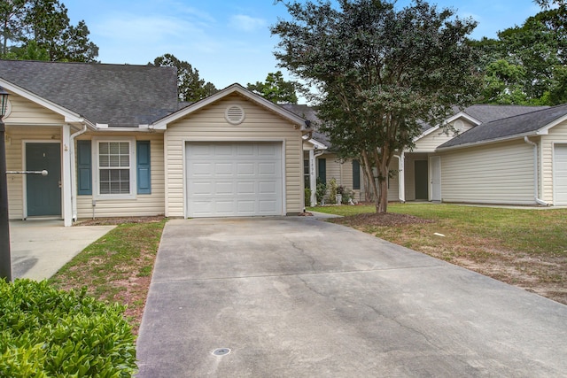 7896 Montview Rd, North Charleston, SC 29418 - ranch-style house with an attached garage, concrete driveway, a shingled roof, and a front lawn