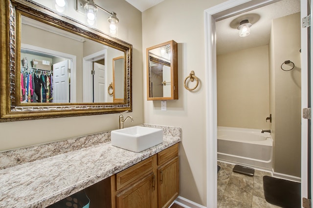 7896 Montview Rd, North Charleston, SC 29418 - full bath with vanity, baseboards, and a tub