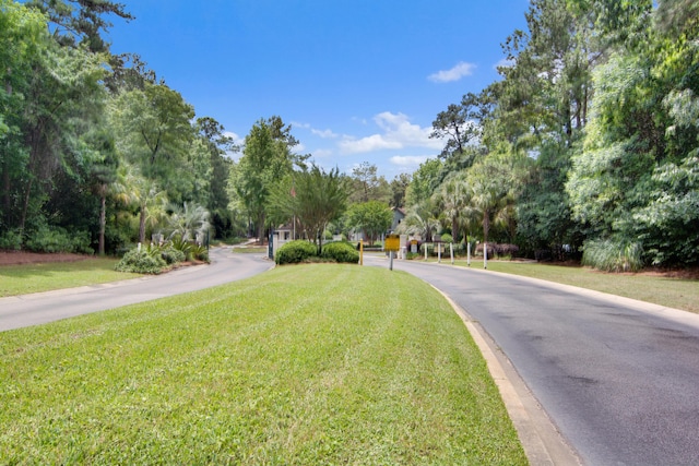 7896 Montview Rd, North Charleston, SC 29418 - view of asphalt street featuring a gated entry and view of scattered trees