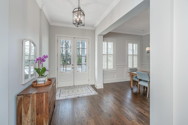 entryway with french doors, dark wood-style flooring, a wealth of natural light, and crown molding