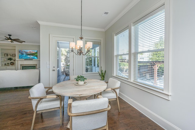 dining area featuring dark wood-style floors, baseboards, a fireplace, and ornamental molding