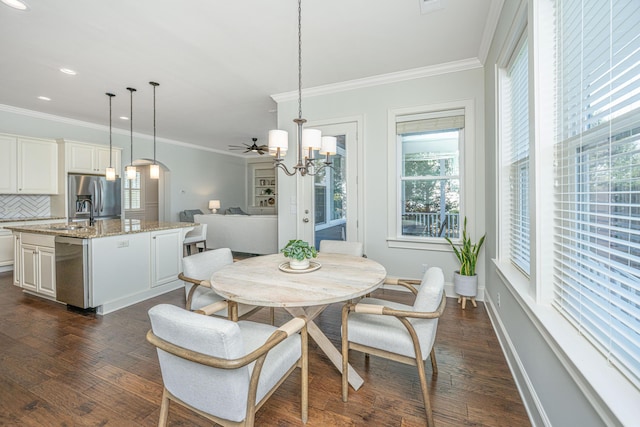 dining space with arched walkways, recessed lighting, dark wood-style flooring, baseboards, and crown molding