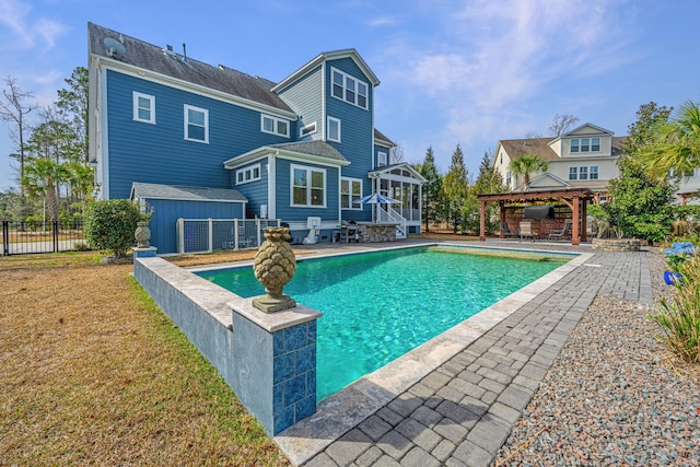 view of pool featuring a fenced in pool, a gazebo, fence, a yard, and an outdoor structure