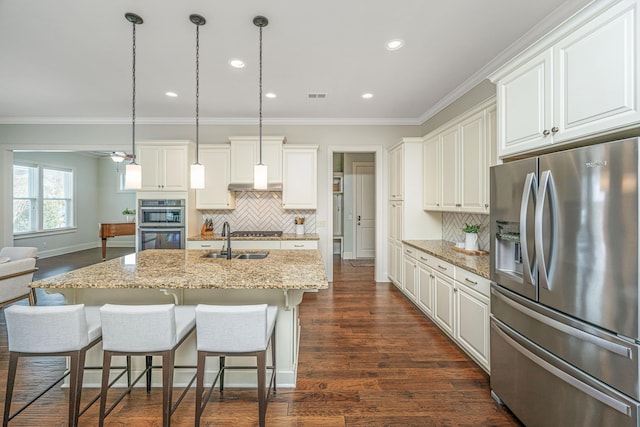 kitchen with dark wood finished floors, visible vents, stainless steel appliances, and crown molding