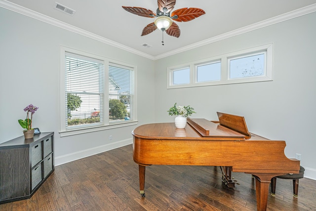 office area with baseboards, visible vents, wood finished floors, and ornamental molding