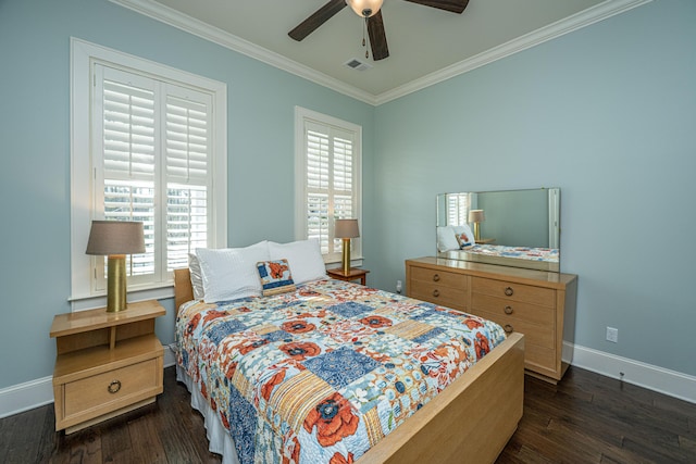 bedroom with dark wood finished floors, visible vents, crown molding, and baseboards