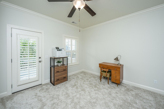 carpeted office featuring a ceiling fan, baseboards, visible vents, and crown molding