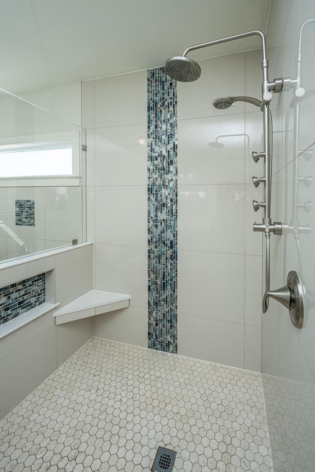 bathroom with tiled shower