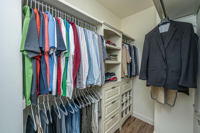 spacious closet with wood finished floors