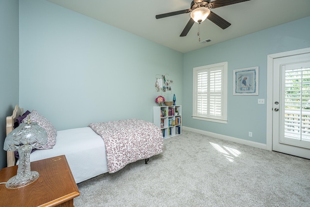 bedroom featuring carpet floors, visible vents, a ceiling fan, access to outside, and baseboards