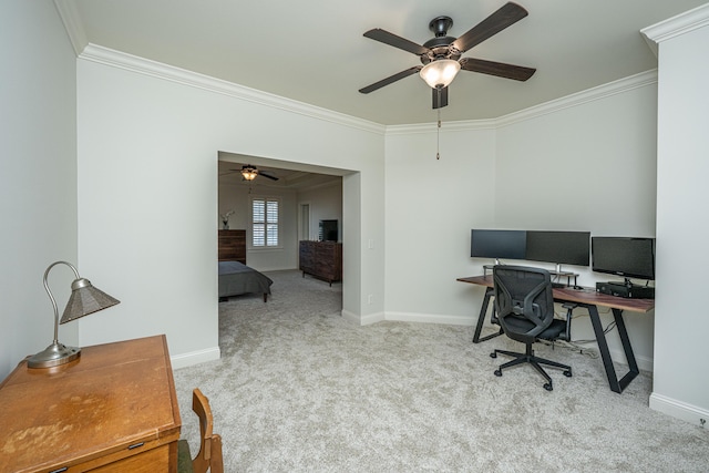 home office with carpet, crown molding, and baseboards