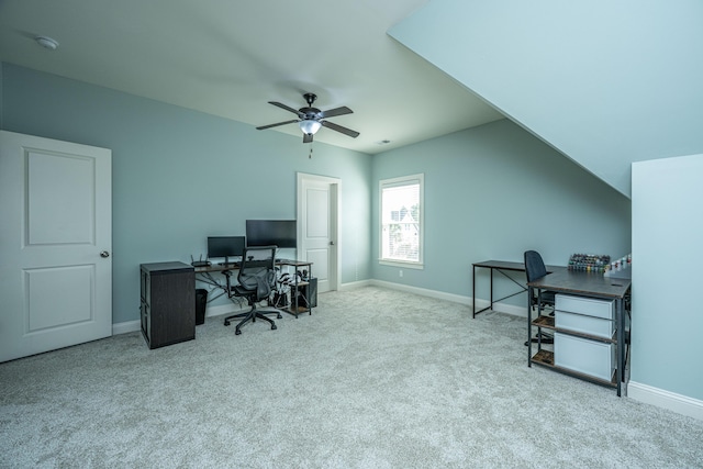 office space featuring carpet, ceiling fan, lofted ceiling, and baseboards