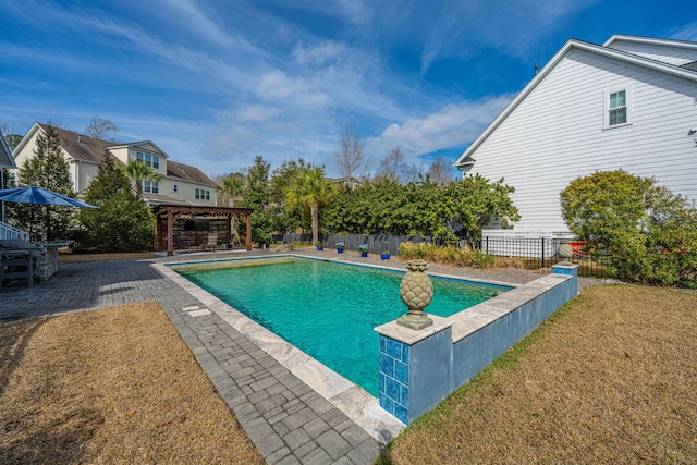 view of pool with a fenced in pool, a patio, a lawn, a gazebo, and fence