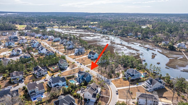 bird's eye view with a residential view and a water view