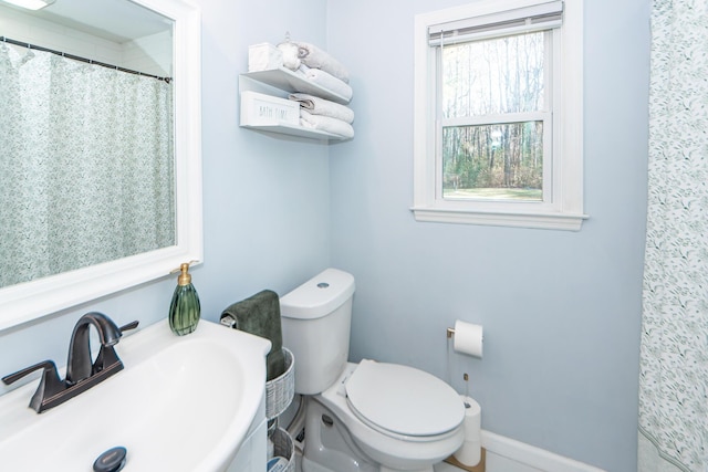 bathroom featuring sink and toilet