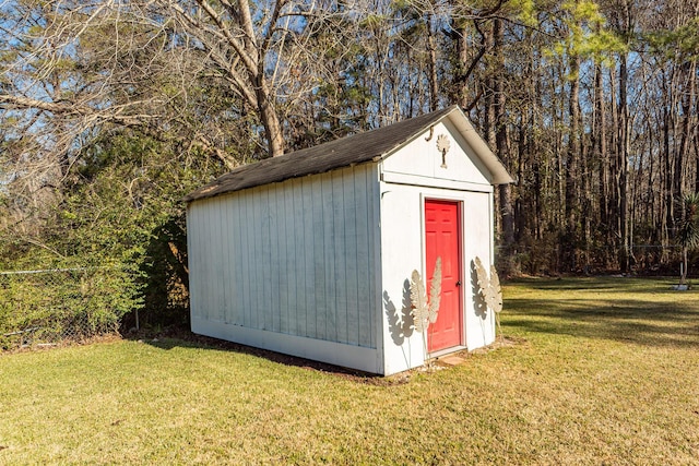 view of outdoor structure with a lawn