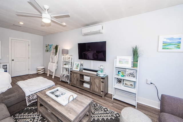 living room featuring dark wood-type flooring, ceiling fan, and a wall mounted air conditioner