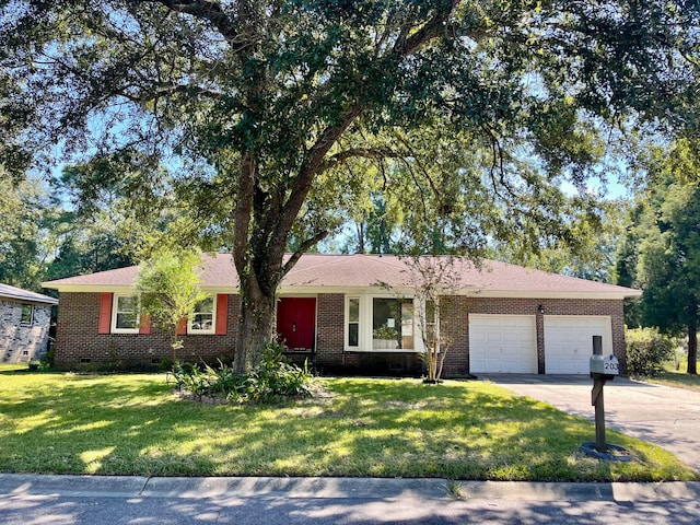 ranch-style home with a garage and a front yard