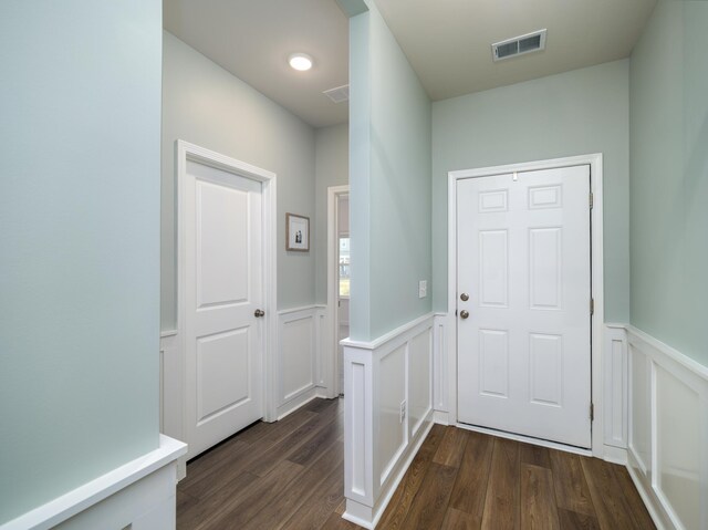 foyer entrance featuring dark hardwood / wood-style floors